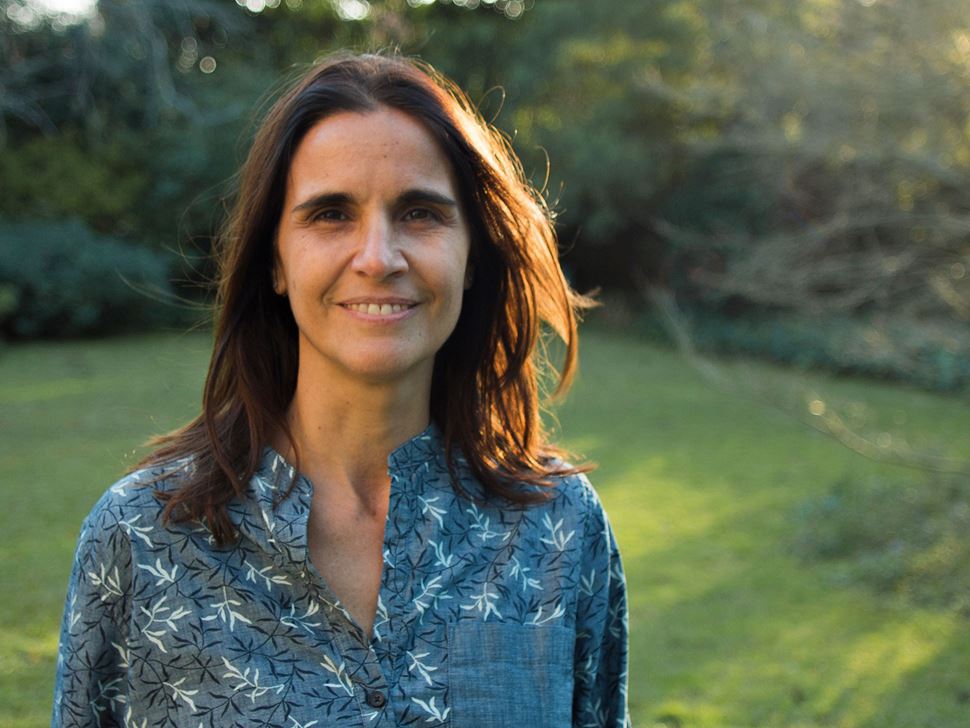 Carola Terreni '19 smiling while standing on a lawn